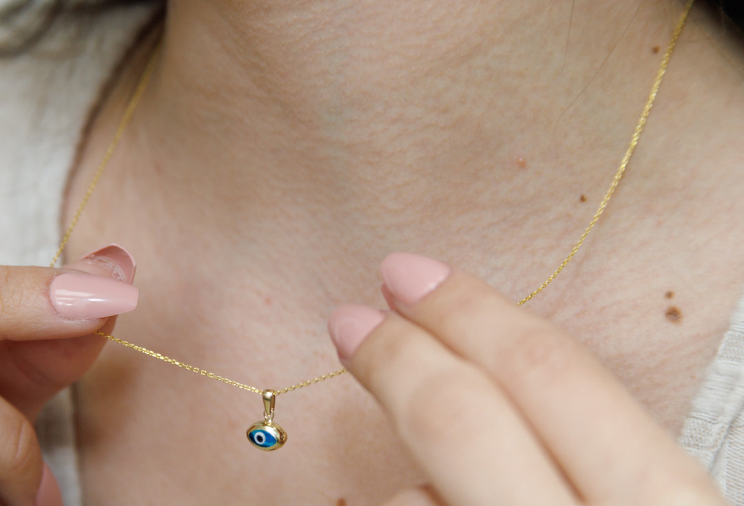 HERSHE, 14 Karat Gold Blue Evil Eye Necklace.