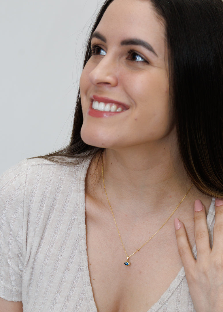 HERSHE, 14 Karat Gold Blue Evil Eye Necklace.
