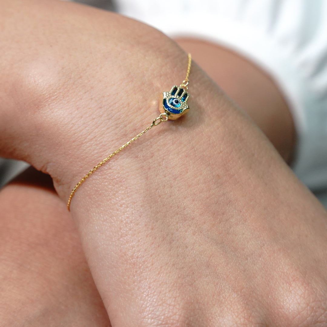 HERSHE, Evil Eye Hamsa Bracelet in 14 Karat Solid Gold.