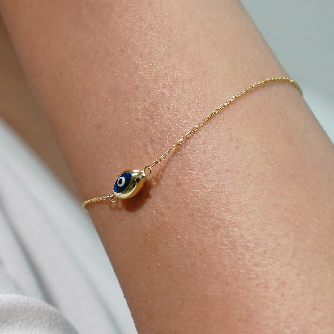 HERSHE, Blue Evil Eye in 14 Karat Solid Gold.