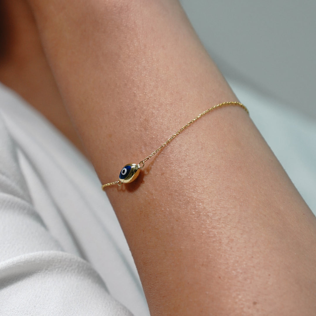 HERSHE, Blue Evil Eye in 14 Karat Solid Gold.