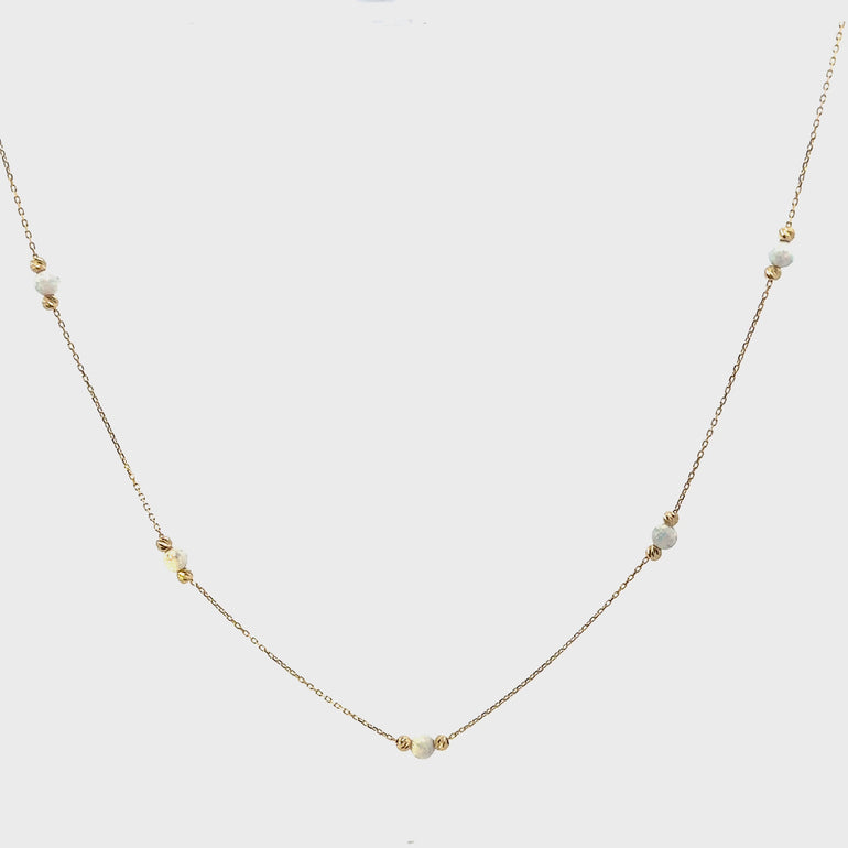 HERSHE, White Opal Bead Station Necklace in 14 Karat Gold.